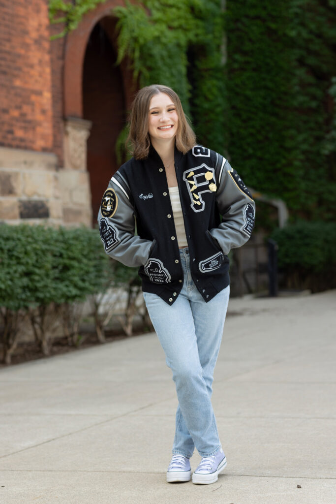 Plymouth high school student featuring urban architecture and vibrant city streets.