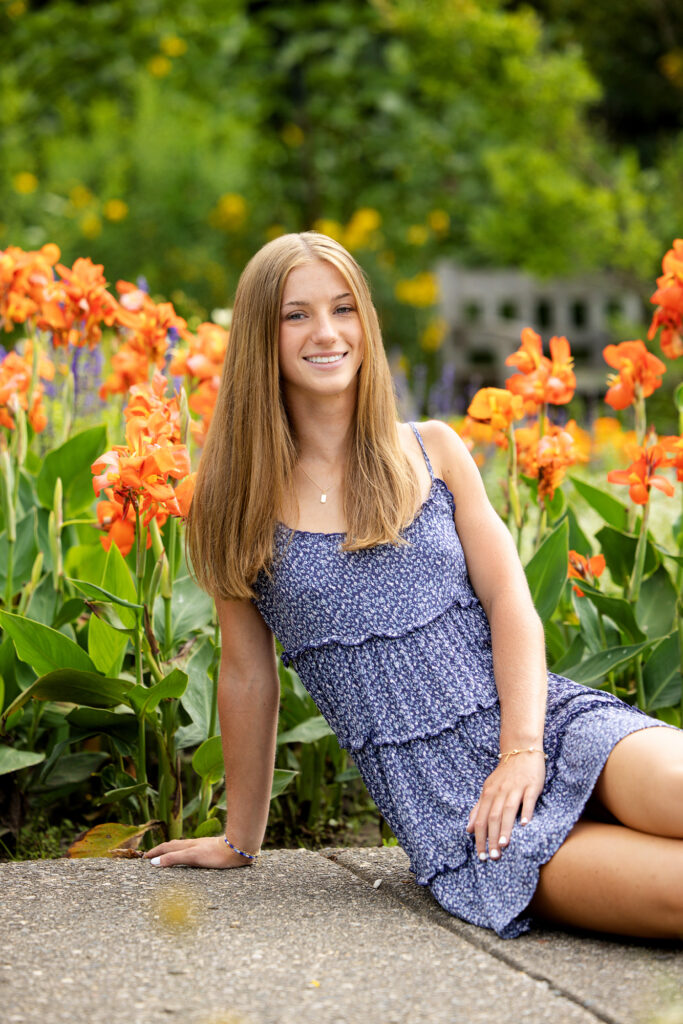 Senior portraits surrounded by flowers and gardens at Matthaei Botanical Gardens in Ann Arbor, Michigan.