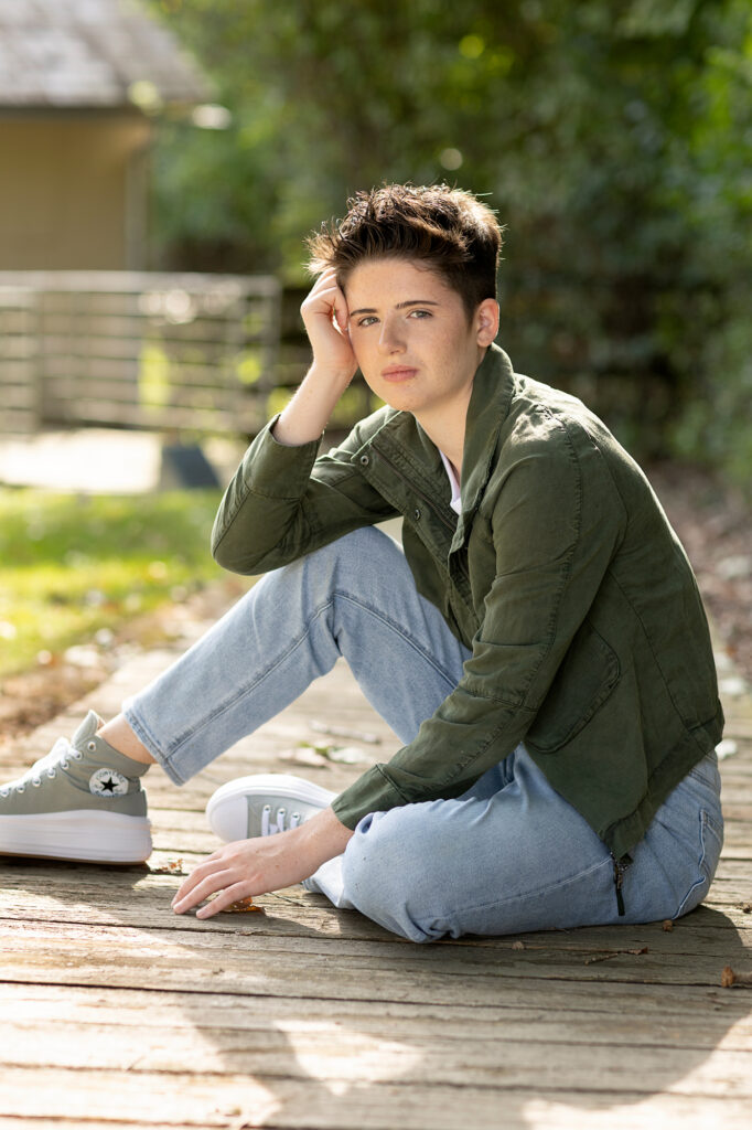 Rustic senior portraits at Parker Mill County Park in Ann Arbor, with an old mill, bridge, and natural trails