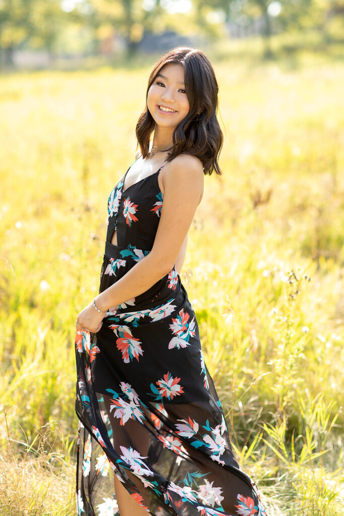 even through this senior wore a black dress the floral pattern works in this field in Farmington